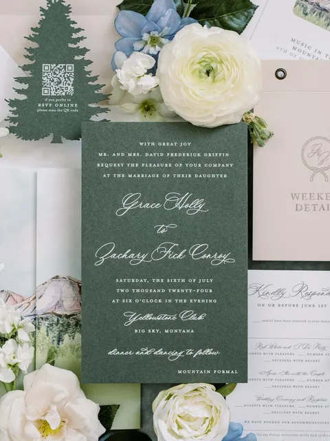 Green wedding invitation by Eros Studios featuring La Rumba calligraphy and a tree-shaped website card. Photograph by Annie Lui Photography Flatlays.