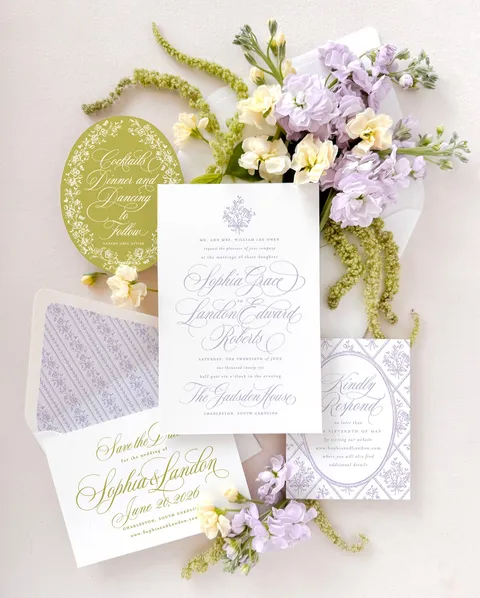 Lavender and green wedding stationery by Empress Stationery featuring Mozart Script calligraphy by Blessed Print, patterned envelope liners and fresh flowers.