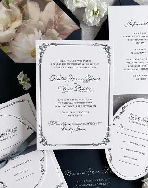 Black and white Tabitha wedding invitation suite by Olivean Weddings featuring La Rumba calligraphy and delicate ornamental borders.