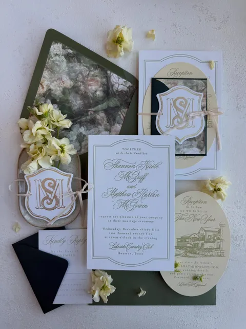 Blue and green Juliette wedding invitation suite by Shop Aurea with shaped cards, illustrated liners and velvet ribbon. Photograph credited to natemessphoto.