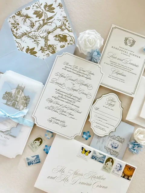 Blue and white wedding invitation suite by Amber LeBlanc Studio featuring Juliette calligraphy, shaped letterpress cards, an illustrated liner and vintage postage.