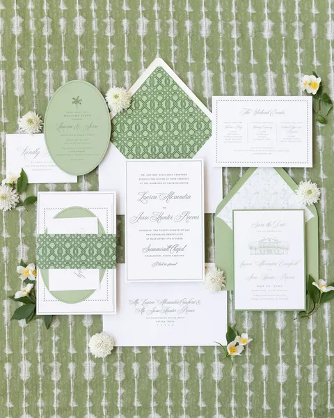 Green and white wedding invitation suite by Kate Eliza Creative with Mozart Script and a patterned envelope liner. Photograph by John Cain Photography.