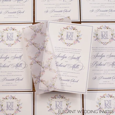 Lavender floral wedding invitations by Elegant Wedding Invites featuring Mozart Script, a personalized monogram and printed vellum wraps.