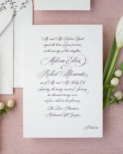 Classic black letterpress wedding invitation by Sarah Brown of Banter & Charm with Mozart Script calligraphy on white cotton paper.